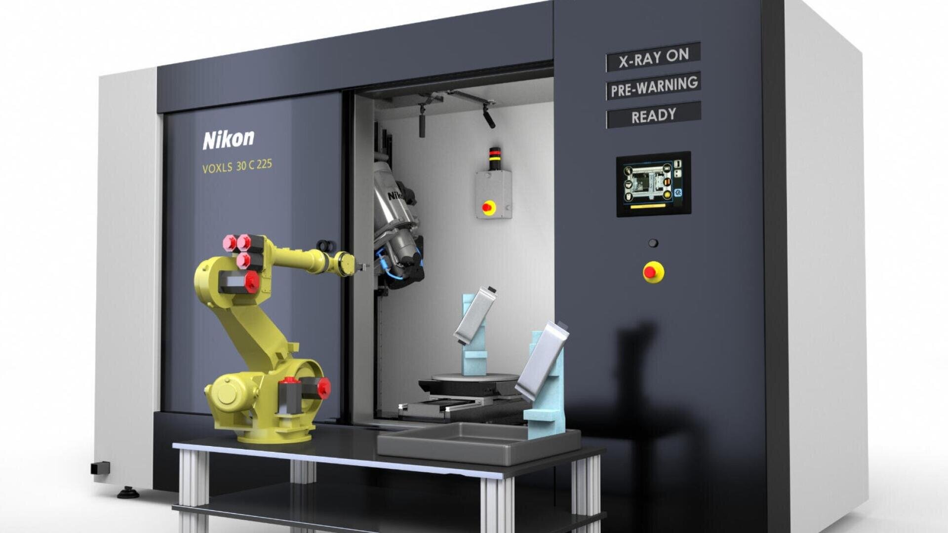 Un appareil de radiographie industrielle Nikon VOXLS 3D C225 avec un bras robotisé positionné devant une chambre ouverte. Des indicateurs d'état s'affichent sur le panneau de commande et l'appareil semble prêt pour la numérisation.