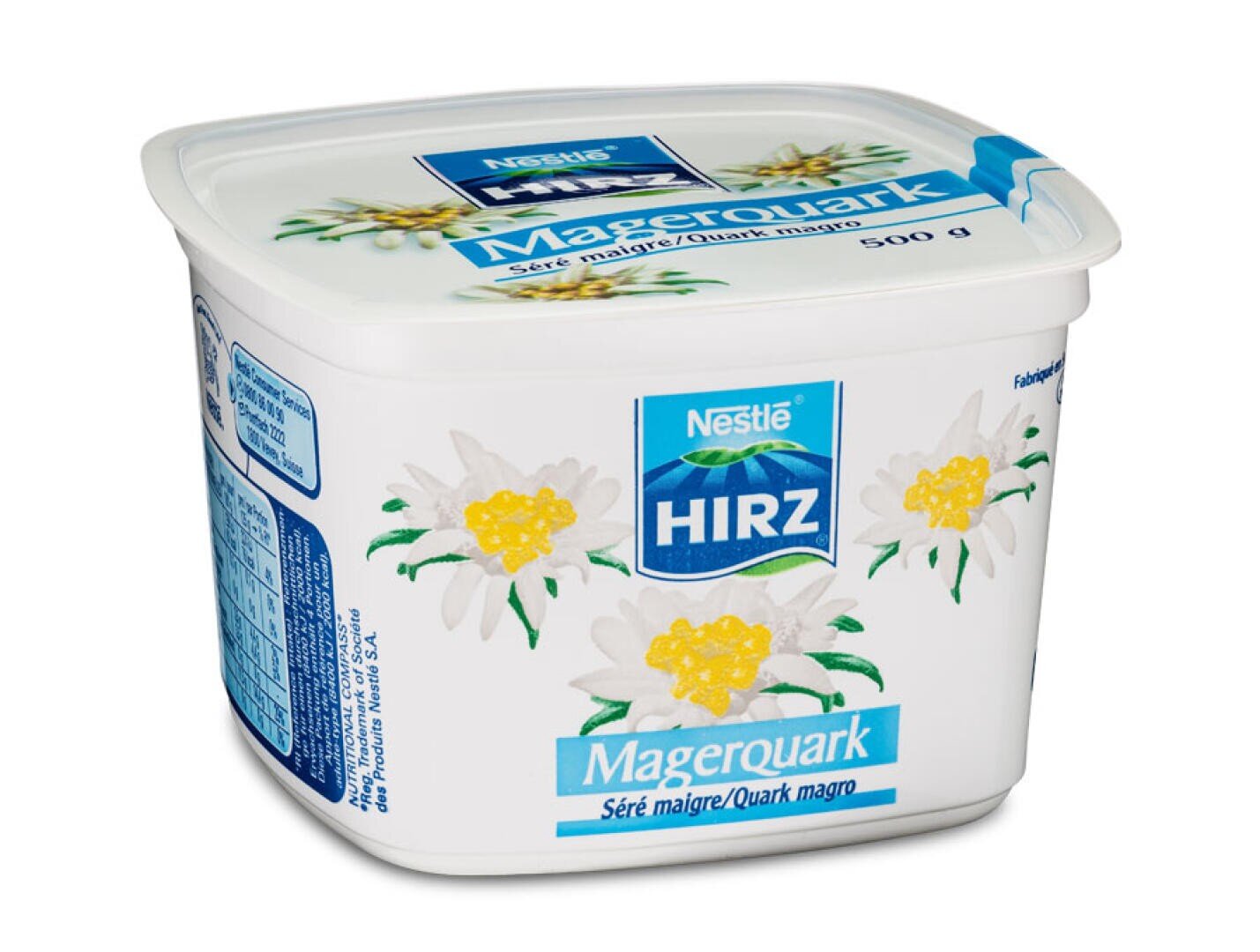 Eine 500-g-Dose Nestlé Hirz Magerquark, verziert mit gelben und weißen Blüten, mit blauer und weißer Aufschrift in mehreren Sprachen.